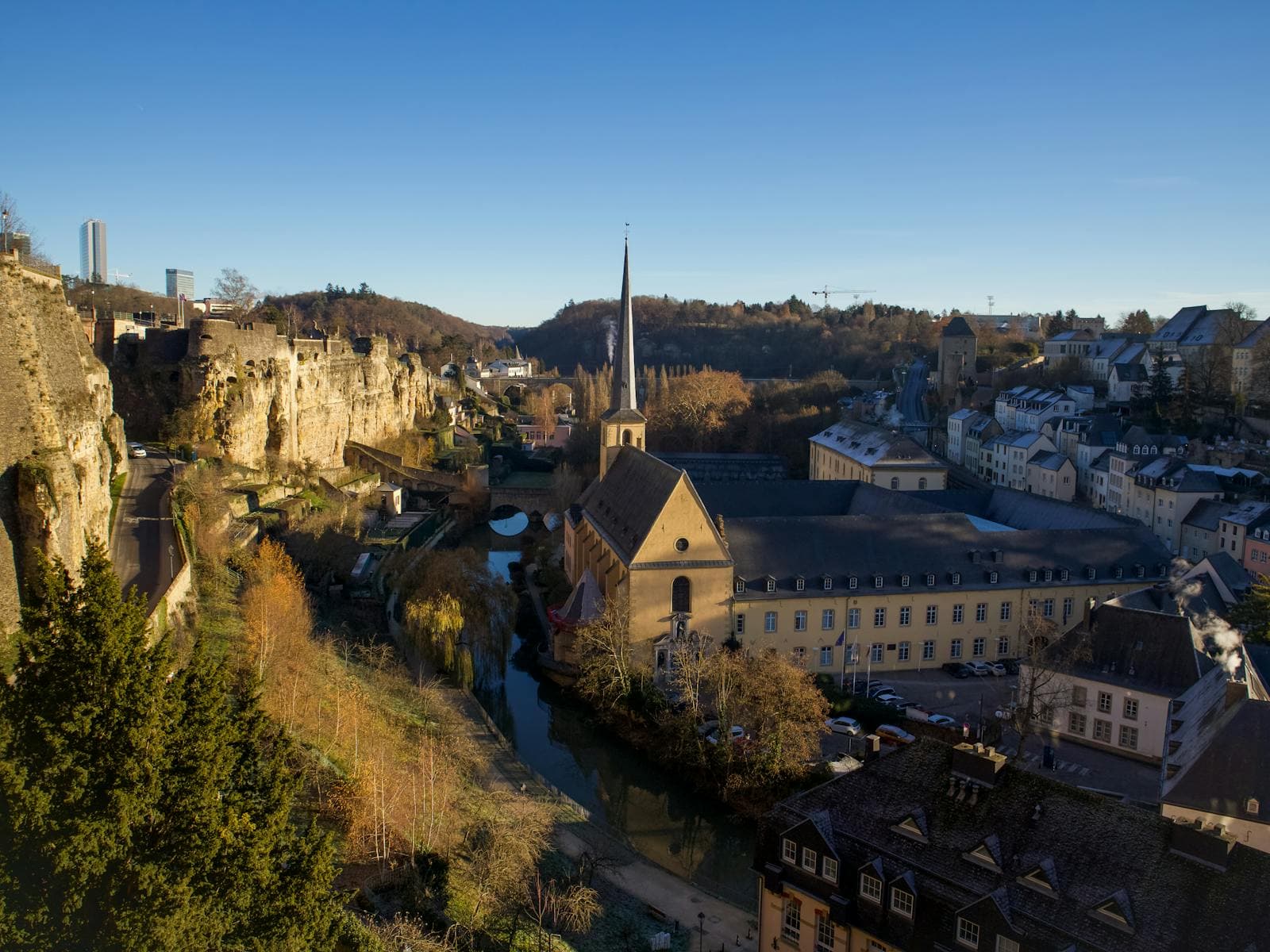 Luxembourg City cityscape with a historic church above the canal.
