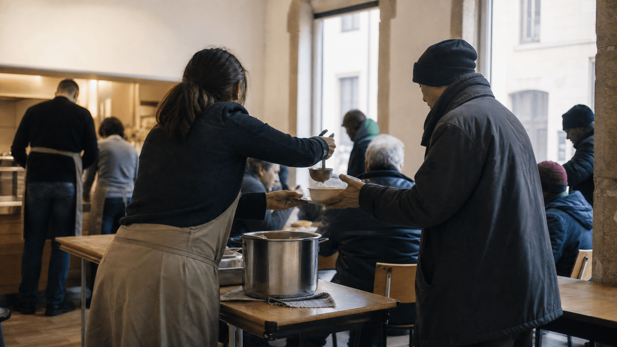 A community meal service in Luxembourg, photographed without identifiable faces.