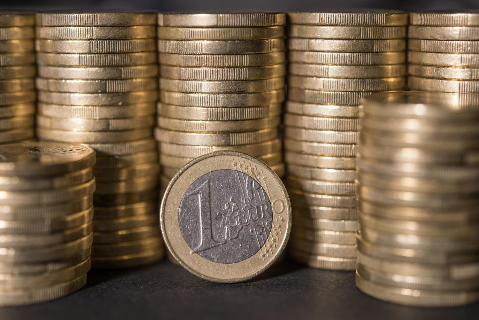 Macro photograph of stacked euro coins.