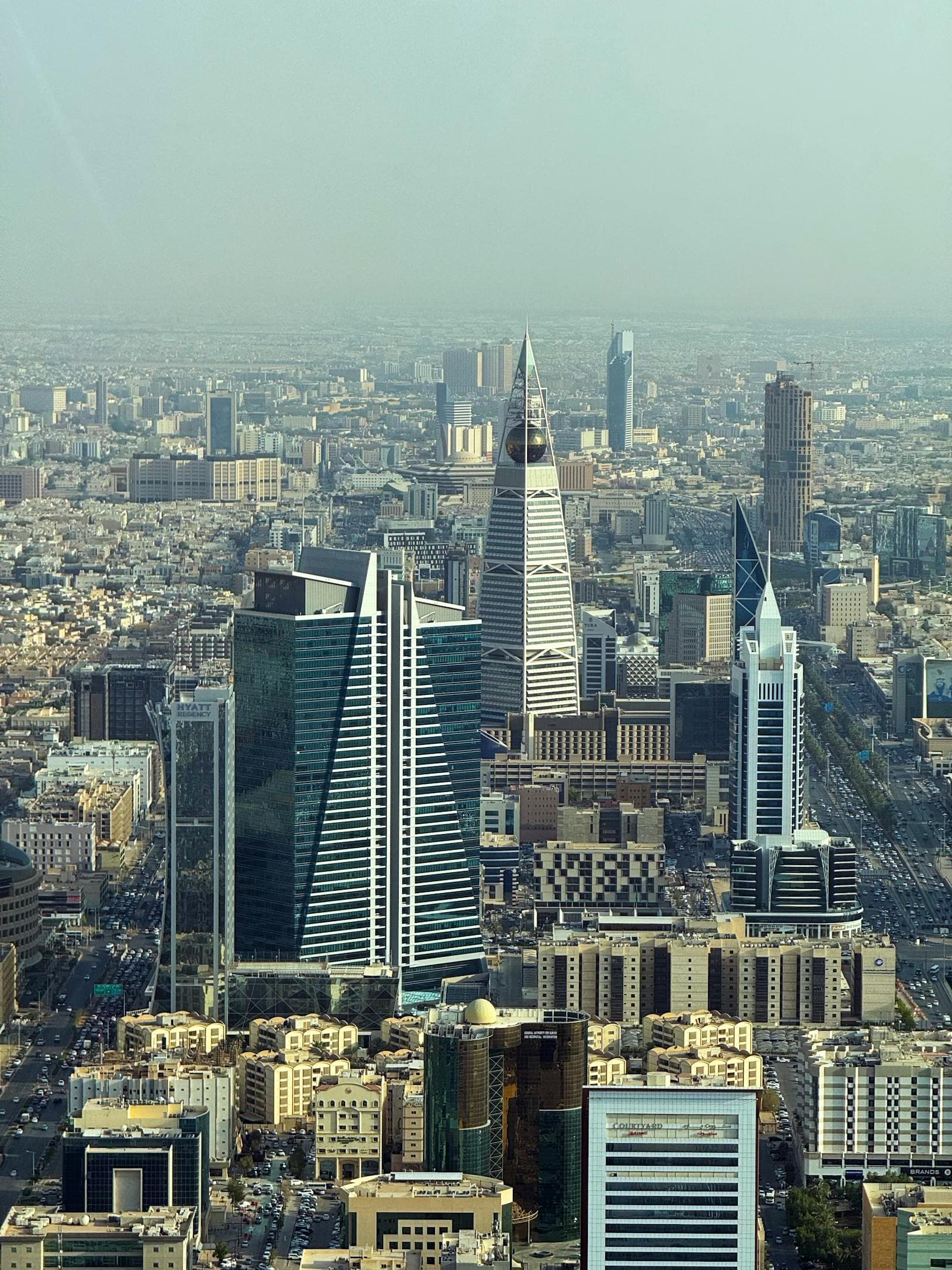 Riyadh skyline at twilight with the Kingdom Centre and Al Faisaliah towers.