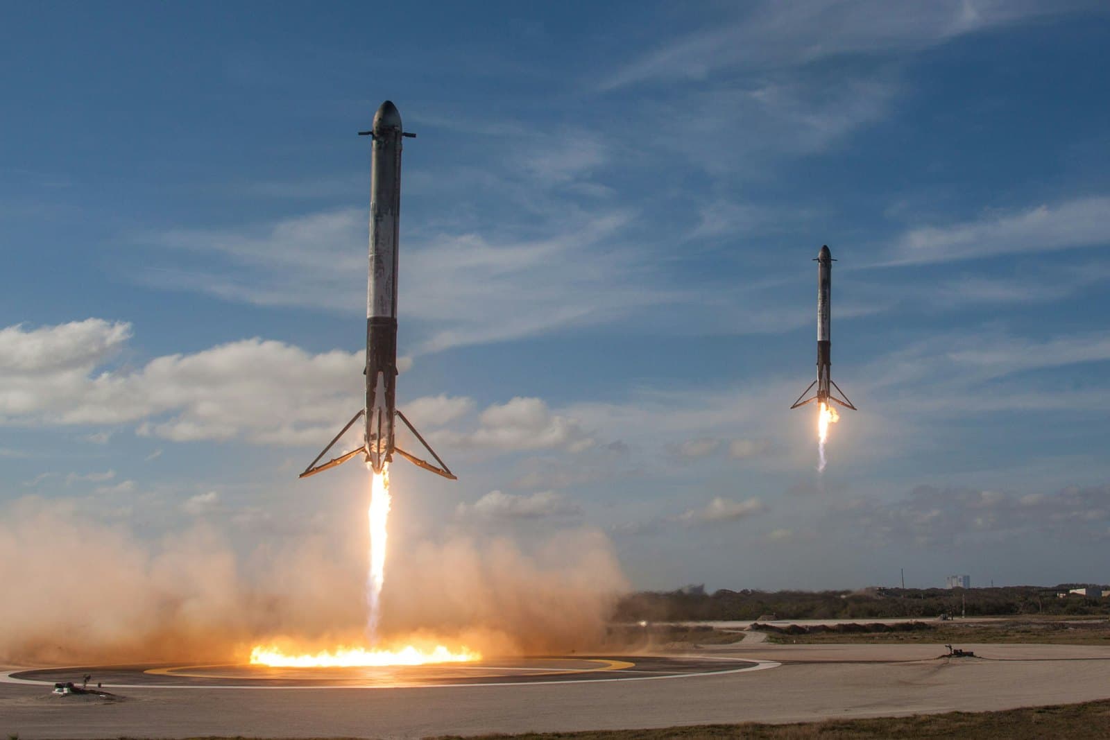 A SpaceX Falcon 9 lifting off at twilight.